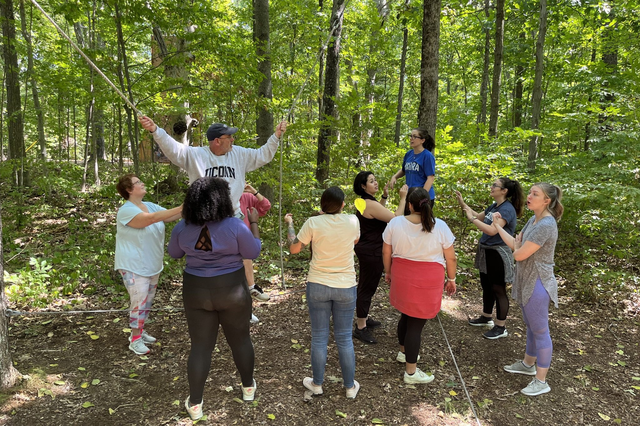 Students work together to complete challenge course activity